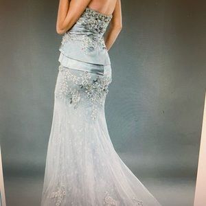 Jovani 1921 elegant long mermaid gown with silk tiered panels and beading